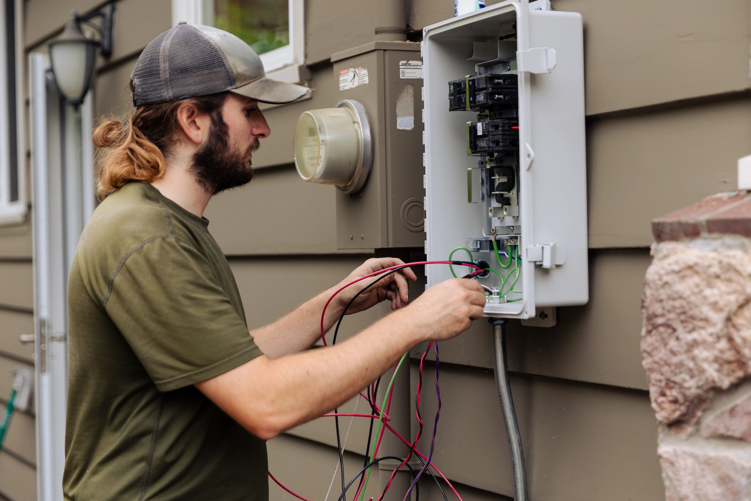 Technician working on an electrical panel